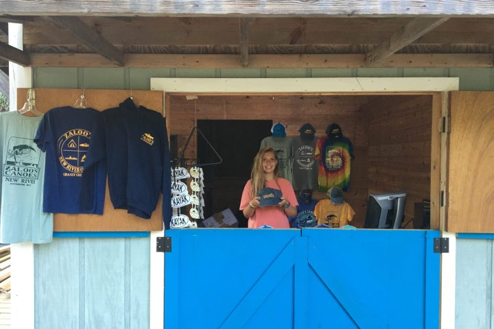 a person standing in front of a blue door