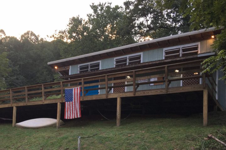 a train is parked on the side of a building